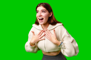A woman wearing a skirt and sweater is striking a pose for a picture, standing confidently in front of the camera.