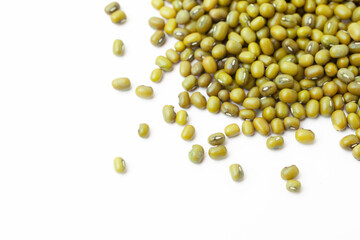 Green mung beans pile on white background. Dry mung beans grains. Top view