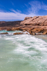 A beautiful beach with red granite rocks. Wylie Bay, Esperance Western Australia.