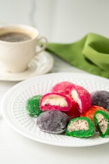 Multi-colored Japanese cakes Mochi in a white plate