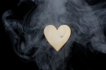 Valentine homemade wooden love hearts burning an burned smoking with unique patterns and textures
