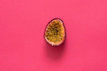 Passion fruit isolated on pink background. Top view. Flat lay.