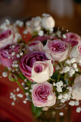 A bouquet of pink roses on the table. Bouquet for a date