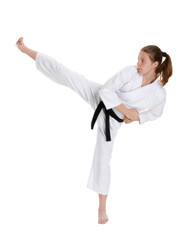 Female Karate kid kicking isolated on transparent layered background.