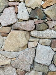 wall and stones of Sardinian granite from Gallura