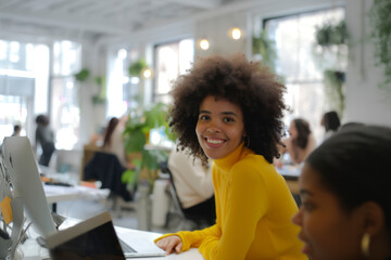 Young african american afro woman with blond curly hair with notebook in the office. - Powered by Adobe