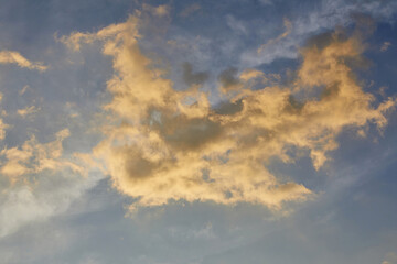 Fototapeta na wymiar Fluffy clouds during sunset