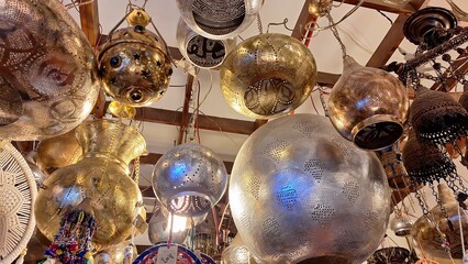Arabic copper lamps in the store, hanging from the ceiling - Powered by Adobe