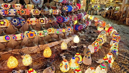 Colorful mosaic lamps, exposed in the evening on the street