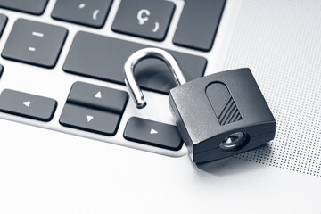 Open padlock on modern laptop. Computer Security Vulnerability concept