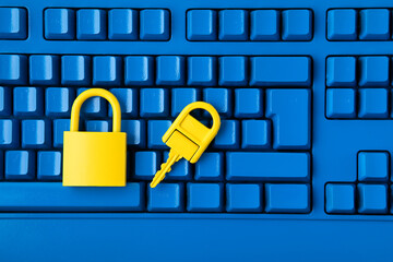Cyber data and information security idea. Yellow padlock and key and blue keyboard. Computer,...