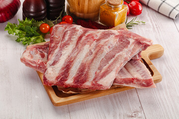 Raw pork ribs over board - 794895777