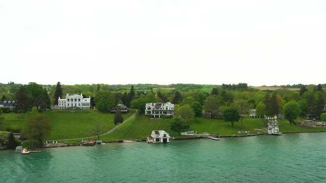 Stunning Dolly Shot Close-Up of a Huge Waterfront Mansion and Boathouse