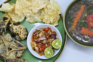 Fried Beef Oxtail with Sambal Balado. Boiled beef oxtail until tender, fried until slightly crispy and served with fresh spicy balado chili sauce.