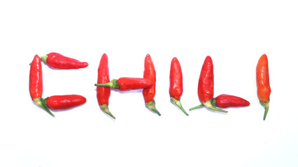 Red hot chili peppers, Red chilies form the word chili on white background
