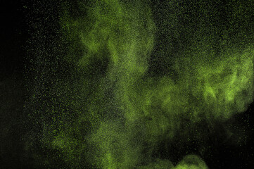 Abstract smoke texture. Light green powder explosion on black background. Citron color cloud. Lime...