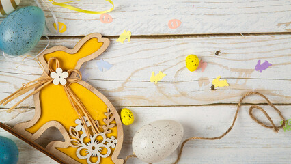 Happy Easter concept. Preparation for holiday. Easter eggs isolated on wooden background. Simple minimalist flat lay top view copy space - obrazy, fototapety, plakaty