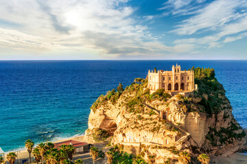 sea landscape of beautiful white temple or castle on a high cliff isle on a rock in crystal clear...