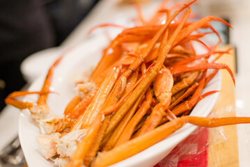 The menu of Alaskan king crab and lamb is ready to be served.