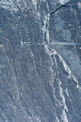 Detail of a dark stone exterior garden path tile surface