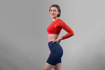 Full body length gaiety shot athletic and sporty young woman in fitness exercise posture on...