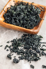 Dried wakame seaweed on kitchen table.