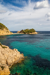 Cala de Sa Ferradura cove and Des Bosc island near Port de Sant Miquel beach, Sant Joan de Labritja, Ibiza, Balearic Islands, Spain