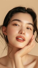 Naklejka premium A woman with a beautiful face is shown with her hand on her face