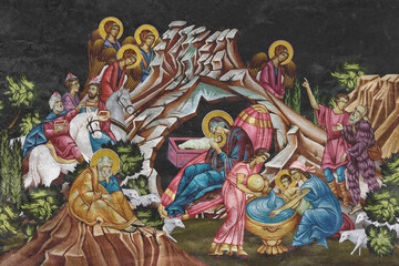 Christian traditional image of Christmas. Religious illustration on black stone wall background in Byzantine style