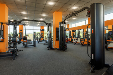 Exercise equipment in an empty gym - obrazy, fototapety, plakaty