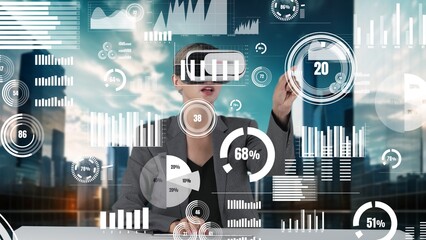 Woman typing on keyboard selecting dynamic market data analysis monitor by VR global innovation interface digital infographic network technology virtual hologram animation on building bg. Contraption.