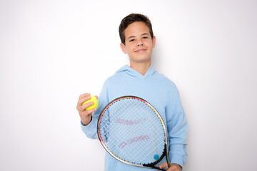 Smiling boy playing tennis holding racket isolated on white background