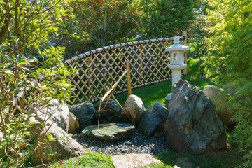 Traditional Bamboo Fountain in Japanese garden. Public landscape park of Krasnodar or Galitsky...