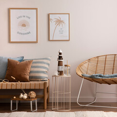 Interior design of cozy and summer living room with rattan armchair, couch, pillows, mock u poster...