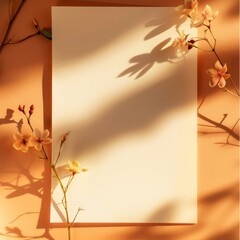 Blank canvas surrounded by cherry blossoms and their shadows on an orange background