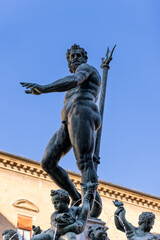 The Fountain of Neptune in Bologna Piazza Maggiore is crowned by a dynamic Neptune statue, trident...