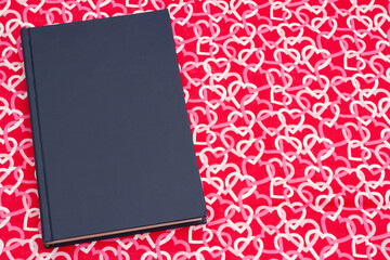 Retro old blue book with red and white hearts