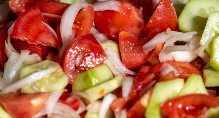 Salad made from fresh vegetables, tomatoes, cucumbers and onions. Seasoned with salt and olive oil.
