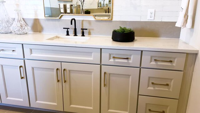 Spacious Master Bathroom with Elegant White Cabinets