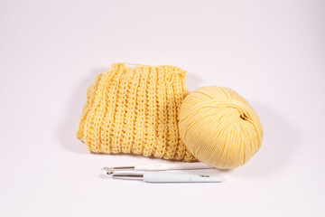 Female hobby knitting. Yellow yarn