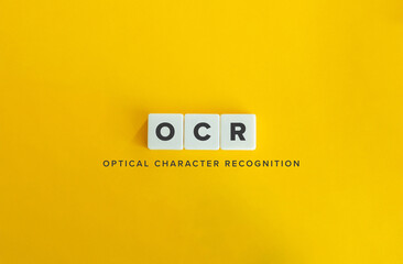 Optical Character Recognition (OCR). Acronym and Text on Block Letter Tiles on Flat Background. Minimalist Aesthetics.