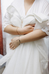 Fototapeta na wymiar Caucasian bride picks up a dress