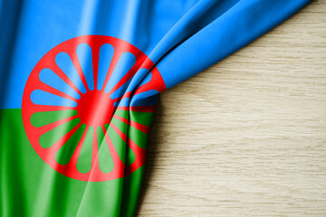 Romani people flag. Fabric pattern flag of Cuba. 3d illustration. with back space for text. Close-up view.