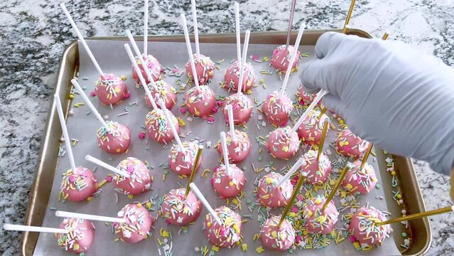 Festive Pink Cake Pops Sprinkled with Colorful Confetti