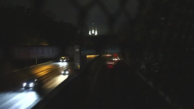Washington DC USA Traffic on the Interstate 495 Beltway at night and the Washington D.C. Temple, or Mormon Temple. 