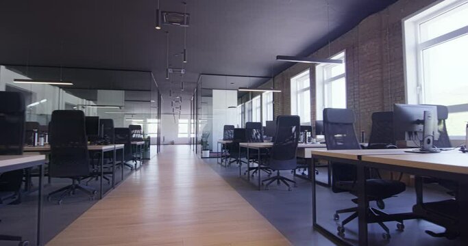 Modern startup centers composed of glass offices within a contemporary corporate environment, highlighting the sleek, innovative, and minimalist design aesthetics of a cutting-edge workspace