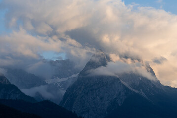 The Zugspitze Mountain in Garmisch-Partenkirchen in Germany with low cloud at sunset