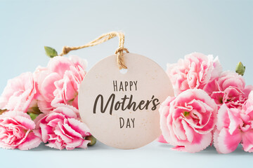 Happy mothers day card with pink flowers on vintage blue background - obrazy, fototapety, plakaty