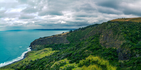 Panoramic view over Te Toto Gorge and Tasman Sea on an overcast summer day. High vantage point. Raglan Waikato