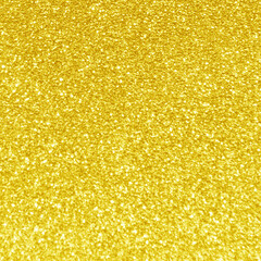 Golden yellow light glitter bokeh texture background.  New Year, Christmas and all celebration...